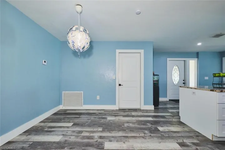 Another angle showing front entry.  Door straight ahead is to the two-car garage.
