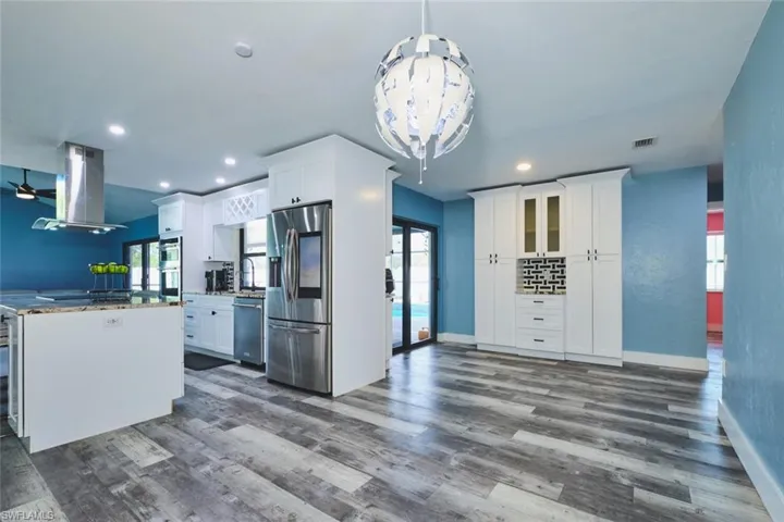 Another view showing entry to the pool area from den/dining area.  Again, all windows are impact.
