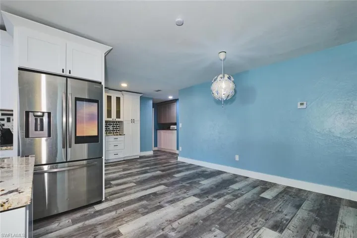The dining area/den is complete with three build-ins.  One behind the refrigerator, one against the back wall and one in the hall way leading to the guest bedrooms..  In between both is the entry to the pool.