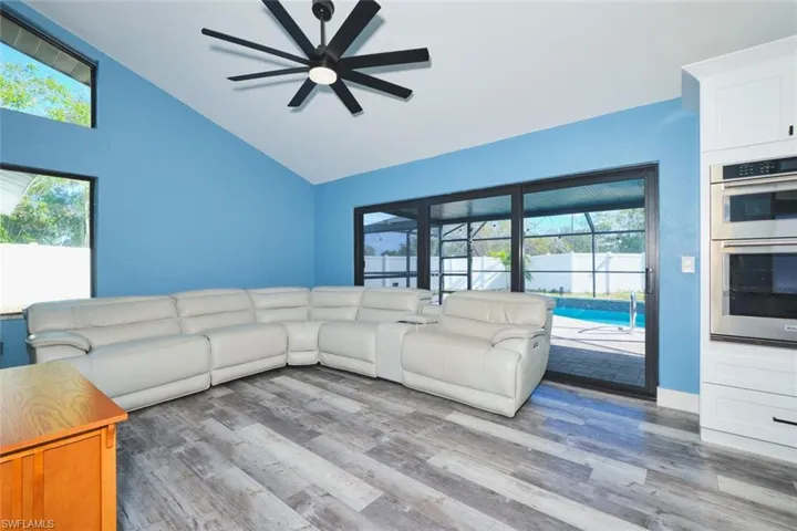 Large triple impact resistant slider and architectural side windows give this room a dramatic look!  Total silence from the outside world!  Cozy sitting area to keep the conversation going while working in the kitchen.