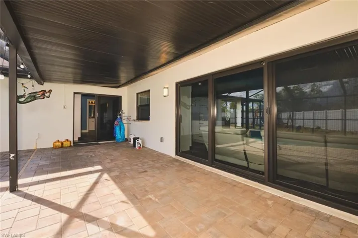 View of the double and triple slider (impact) overlooking the pool.  Make as much noise as you want out here because those windows will make the house extremely quiet!