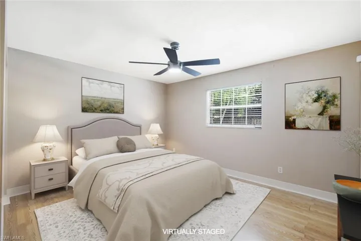 Bedroom featuring light hardwood / wood-style flooring and ceiling fan
