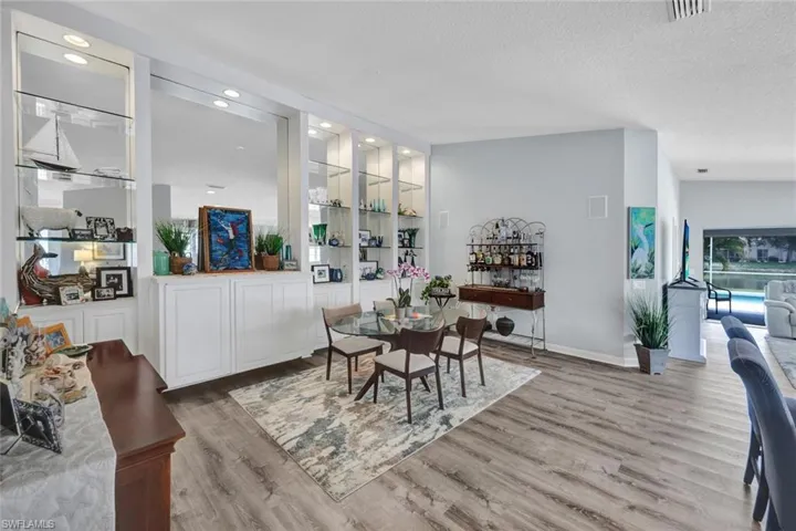 Integrated display shelving with recessed lighting and lower cabinetry