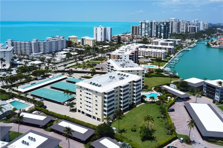 Birds eye view of property with a city view and a water view