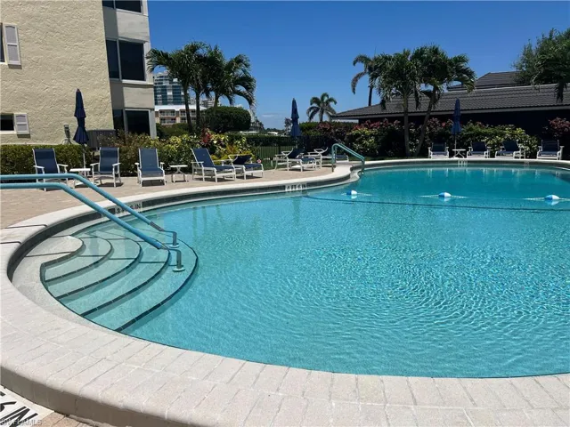 Community pool featuring a patio