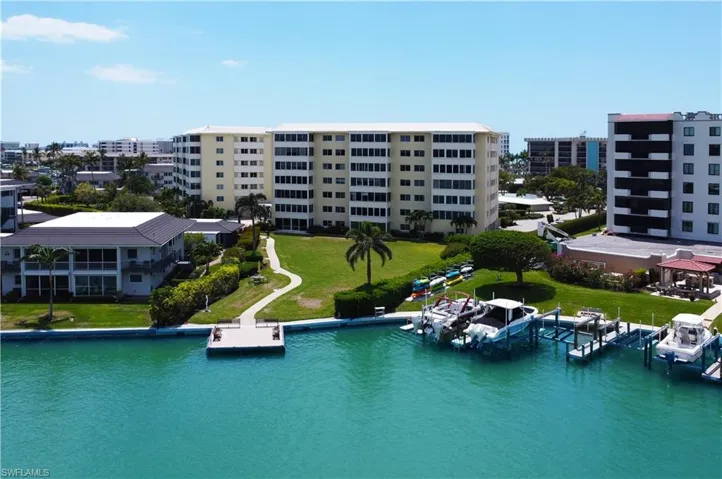 Birds eye view of property featuring a water view