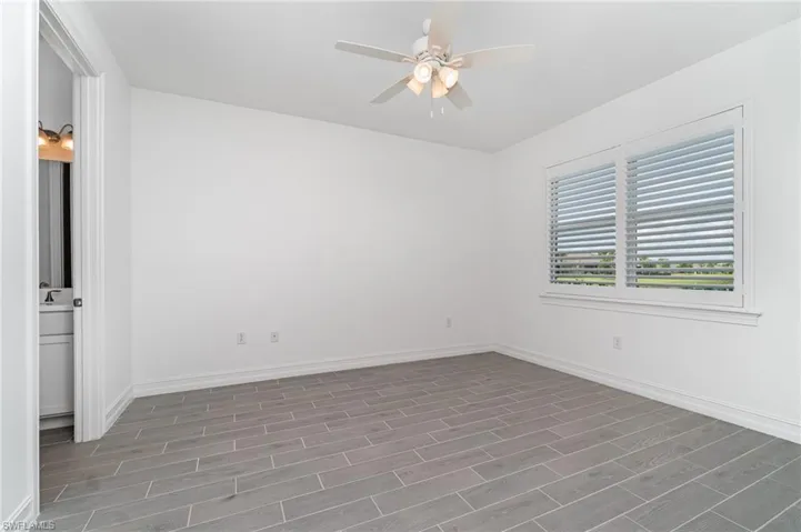 Spare room with ceiling fan and wood finished floors