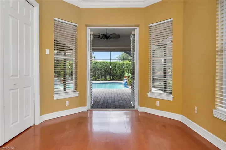 Guest suite with French doors leading to pool.