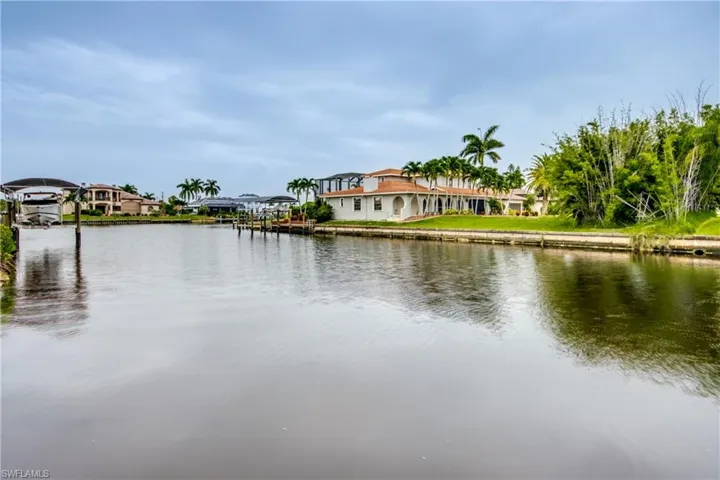 Water view looking up the canal to the North.   Multi-Million Dollar Homes all around