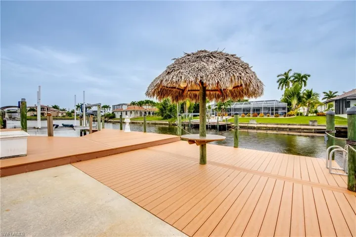 View of dock featuring a water view AND YOUR VERY OWN TIKI HUT
