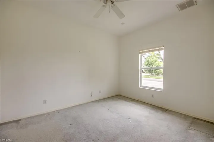 Carpeted spare room #3 featuring ceiling fan
