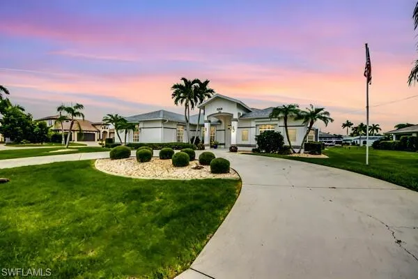 This Grand Estate wraps around the end of the block on a Cul-de-sac.  Go to the end of the block and take a right to enter another 3 car wide driveway with water views!  Spectacular property !!!
