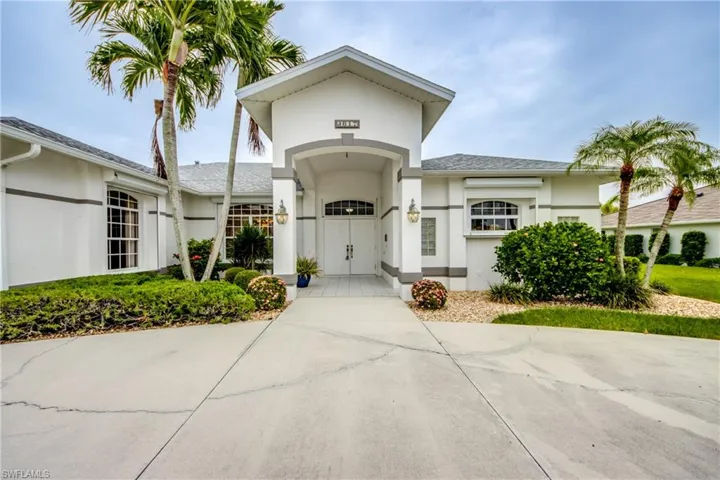 Grand Entrance with double doors, large circular driveway