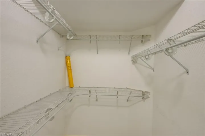 View of walk in closet in Master Bedroom , His and Hers Walk in Closets