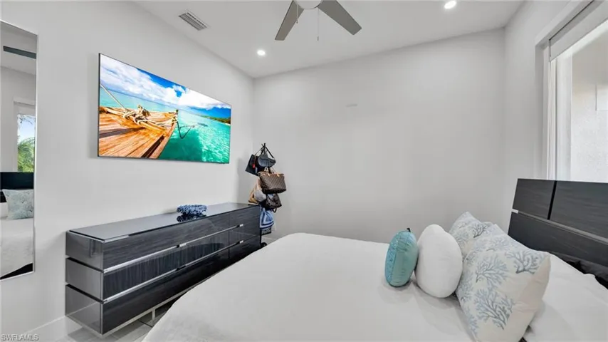 Bedroom featuring recessed lighting and a ceiling fan