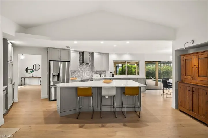 Updated Chef's Kitchen complete with custom cabinetry, stainless steel appliances & large center island.