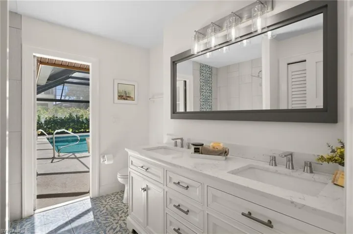 Updated 2nd Bathroom with lanai & pool area access.