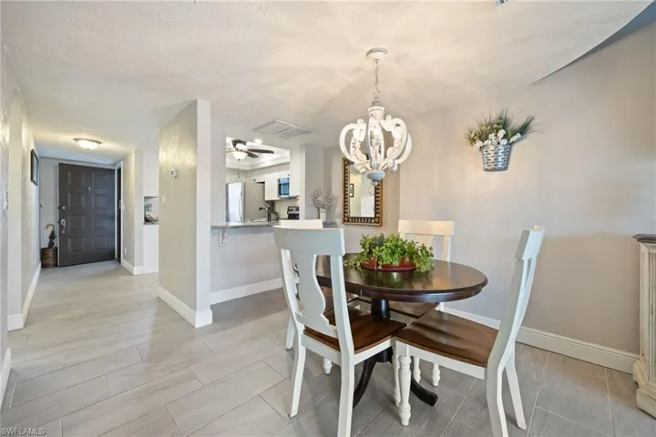 Dining area featuring a decorative chandelier and light-toned wall paint
