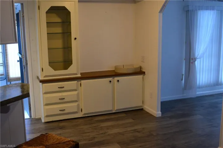 Detailed view of wood finished floors and baseboards