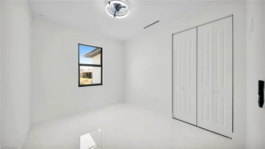 Unfurnished bedroom featuring a closet