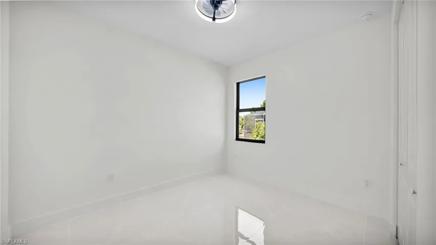 Unfurnished room with baseboards