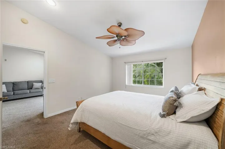 Bedroom featuring carpet and ceiling fan
