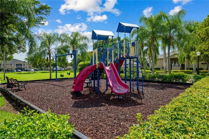 View of play area featuring a lawn