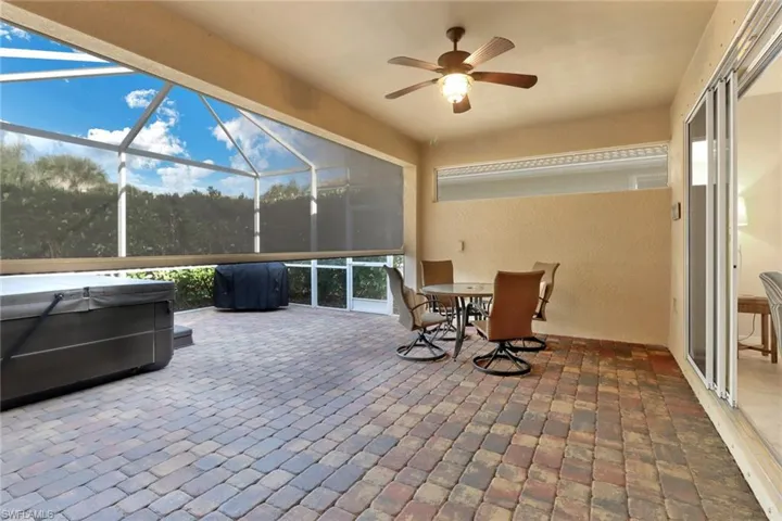 Sunroom / solarium featuring ceiling fan and MagnaTrac shutter allowing for the perfect amount of privacy