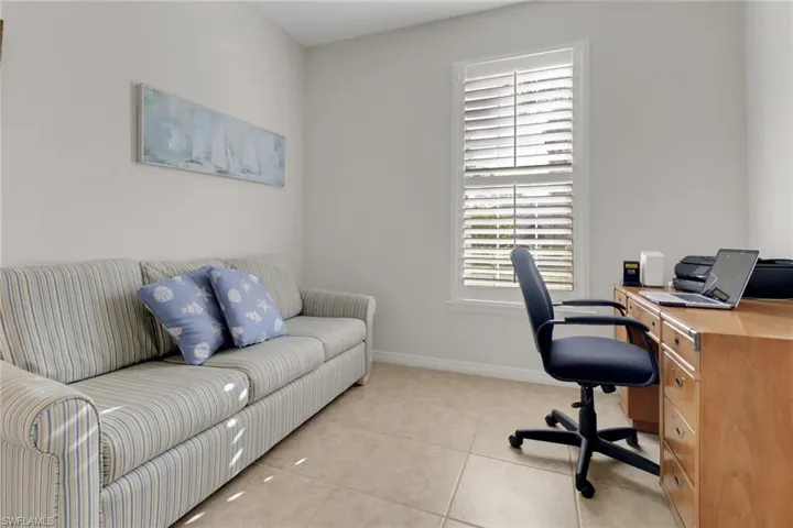 Office area featuring a wealth of natural light and light tile patterned flooring