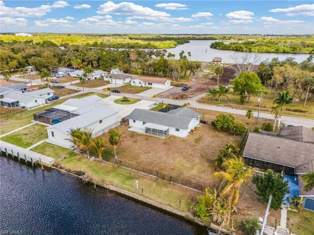 Aerial view of residential area with a large body of water