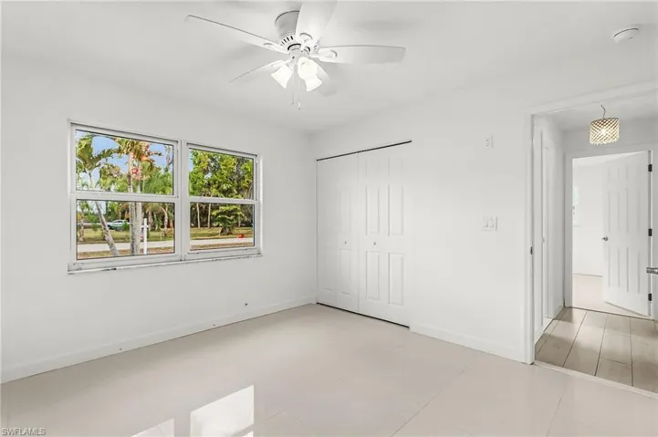 Unfurnished bedroom featuring a closet and a ceiling fan