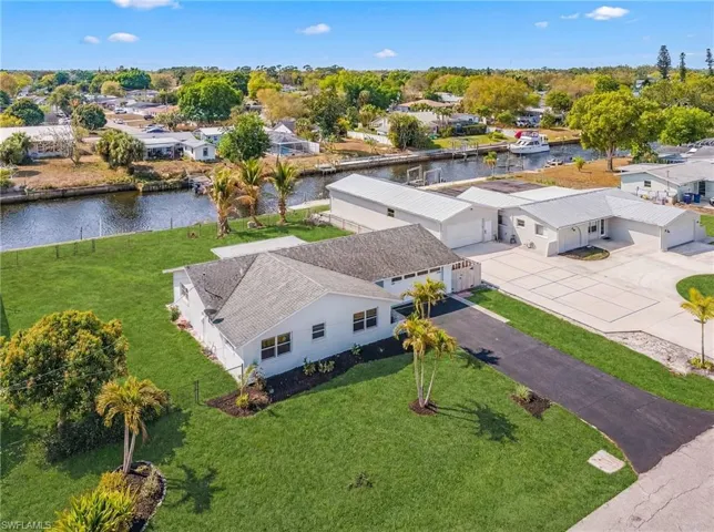Aerial perspective of suburban area with a nearby body of water