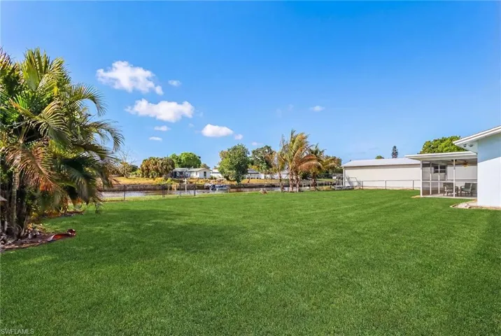 View of yard featuring a sunroom