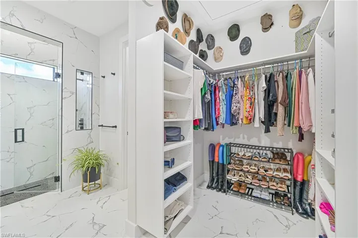 Spacious closet with marble finish floor