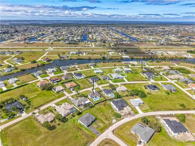 Aerial view with a water view and a residential view