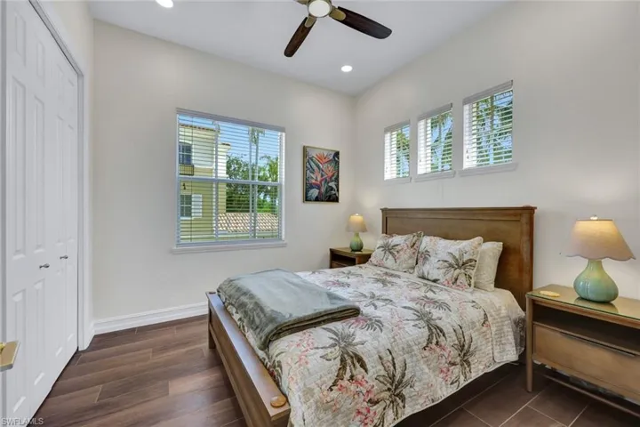 Bedroom featuring a closet, ceiling fan, recessed lighting, and dark wood-type flooring