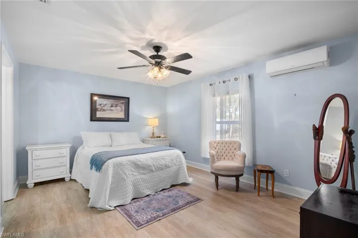 Bedroom featuring light wood-type flooring and a ceiling fan