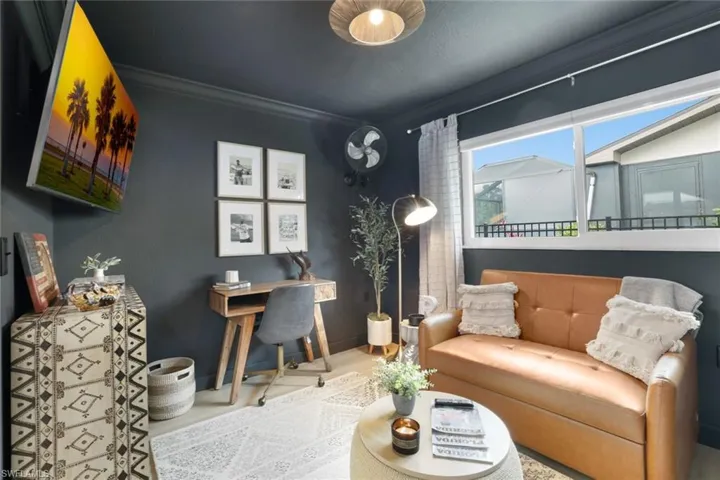 Living room featuring ornamental molding