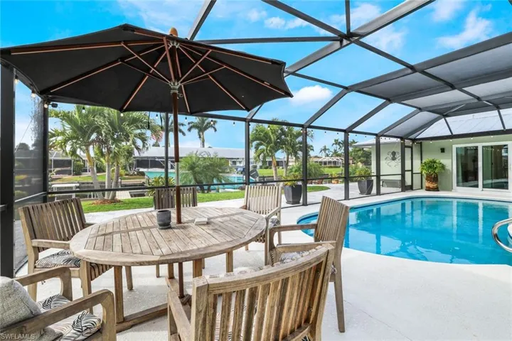 View of pool featuring a lanai and a patio area