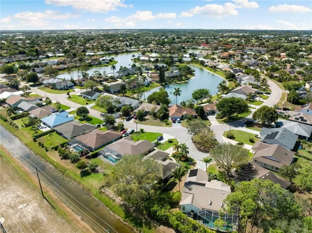 Bird's eye view with a water view and a residential view