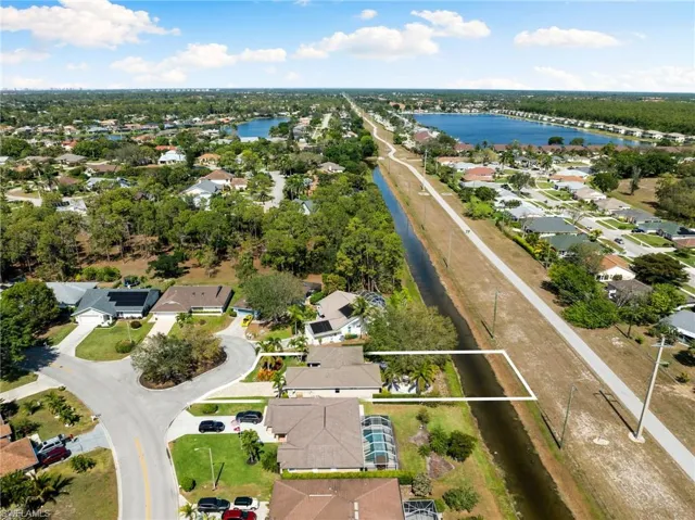 Drone / aerial view featuring a residential view and a water view