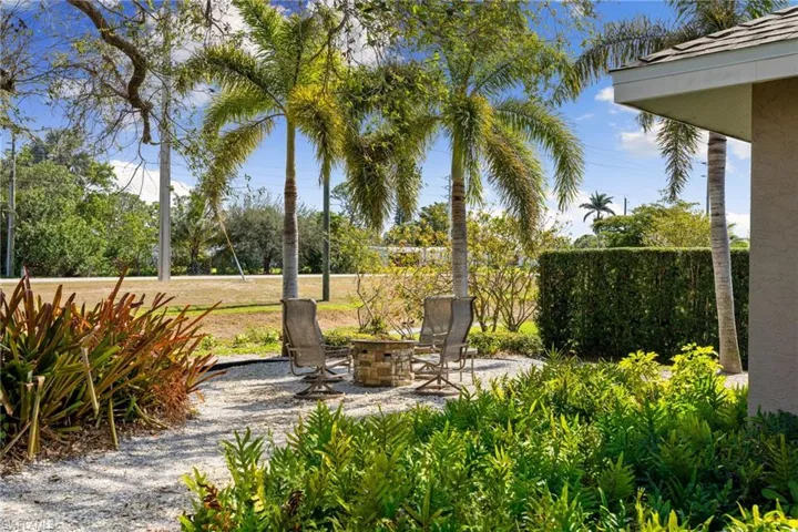 View of patio with an outdoor fire pit