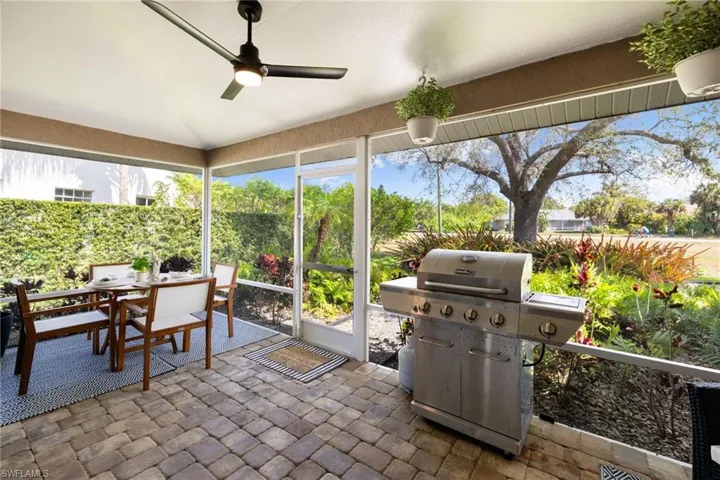 Sunroom / solarium with vaulted ceiling and a ceiling fan