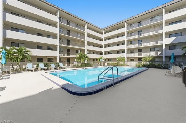 Community pool featuring a patio
