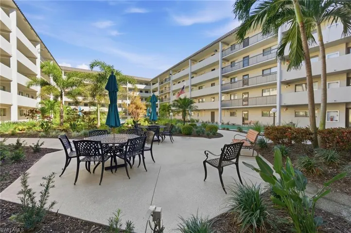 Surrounding community featuring outdoor dining space and a patio