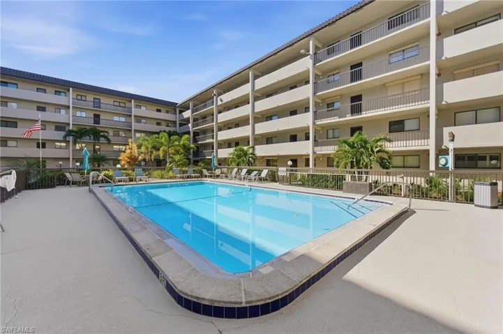 Community pool featuring a patio