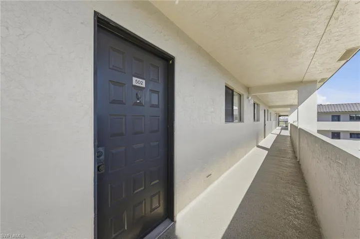 View of exterior entry with stucco siding