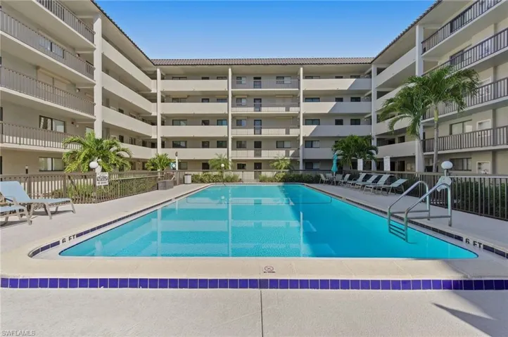 Community pool featuring a patio