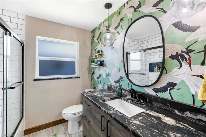 Bathroom with oversized vanity and toilet