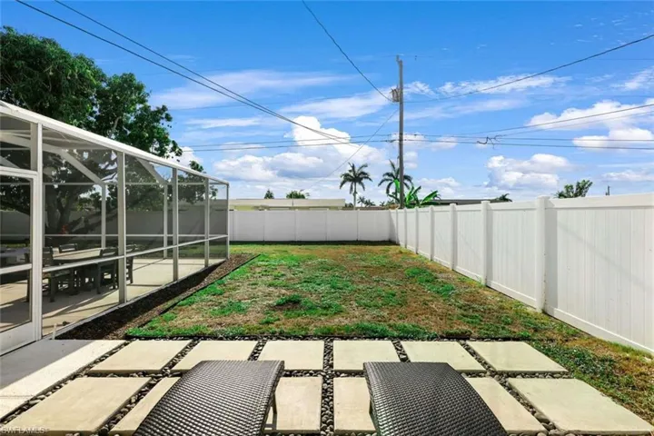 View of yard with a patio and a lanai
